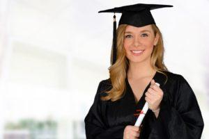 Young successful woman graduating from college holding a diploma